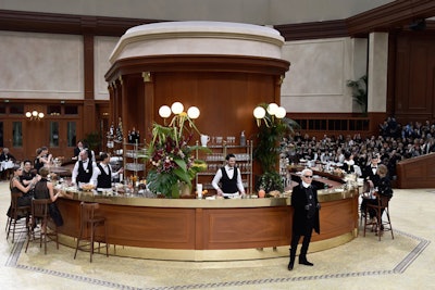 Following his runway bow, Karl Lagerfeld went behind one of the bars to serve up answers to reporters and conduct his post-show interviews. The natural buffer alleviated what has traditionally been an issue in the past: overcrowding.