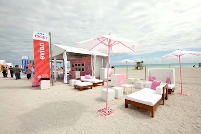 White lounge chairs for Evian event on the beach