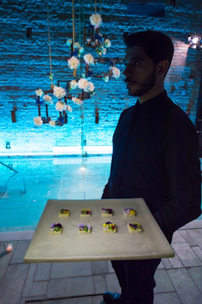 To match the floral imagery in the campaign and the surreal feel to the event, caterer Creative Edge supplied a menu of small bites served with edible flowers, such as 'mosaic of spring bloom canapes' that included crushed avocado, whipped white bean, Johnny-jump-ups, opal basil, and pansies.