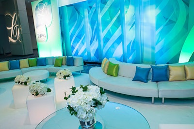 Guests arrived via white carpet that led from the venue entrance into the check-in area where DC Rental provided white sofas accented by lime green, yellow, and light blue pillows.
