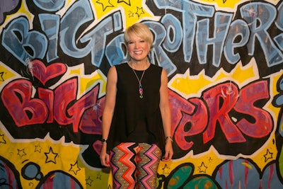 Guests, including Big Brothers Big Sisters of Massachusetts Bay's C.E.O, Wendy Foster (pictured), posed in front of a graffiti-decked step-and-repeat.