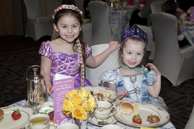 Children who attended the Cinderella Sunday event were encouraged to dress up as their favorite princes and princesses. Decor at the Cinderella event included blue toile tablecloths and sweet arrangements of roses in mint julep cups.