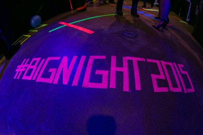 The event's hashtag was spelled out in glowing neon tape on the floor.