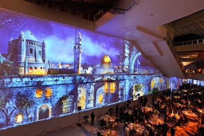 During dinner, guests were immersed in a series of large-scale projections that portrayed Jerusalem scenes. The projections slowly and subtly transitioned from day to night over the course of the meal, surprising guests.