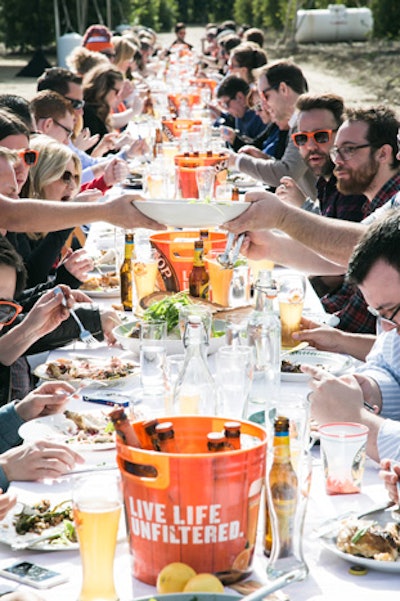 In February, the Anheuser-Busch-owned beverage brand Shock Top launched its summer seasonal Lemon Shandy beverage at a Southern California lemon grove. There, guests dined on warm-weather fare served at a long banquet table, dressed simply but eye-catchingly with citrus-colored buckets of the brand’s beverages.