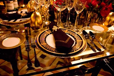 Michael C. Fina's look featured luxe black and gold settings on a glass tabletop.