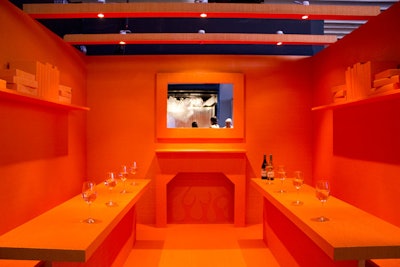 Swedish design company Bolon covered every inch of its space with tangerine-colored floor covering, creating a uniform, but expressive, dining area.
