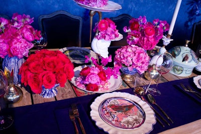 Anthropologie's hot pink and red flowers popped against the rich blue walls and table runners.