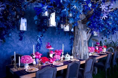 Inspired by the ceramics of South African artist Ruan Hoffmann and murals by Rebecca Rebouche, interior designer Alexis Givens created a moonlight feast setting for Anthropologie with a ceiling covering made from bright blue-painted recycled plastic bottles.