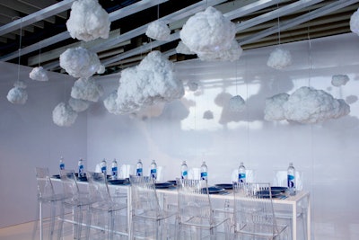 Smartwater's space aimed to reflect the brand's natural water purification process, which is mirrored after rain clouds. The fluffy fixtures lit up like a storm above the simple table setting.