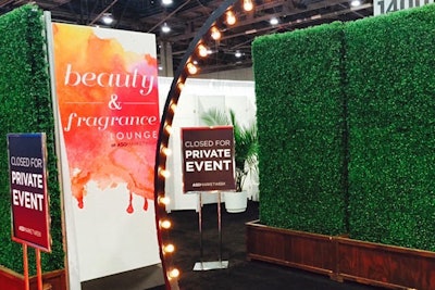 For the reception, organizers used tall faux hedges from other lounges on the show floor to add privacy to the entrance.