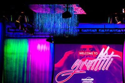 Bright neon lights and draping helped the event channel old-school 'glitz' and modern-day urban graffiti.