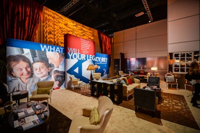 One lounge was designed with a heavily residential style, from comfortable couches with a variety of accent pillows to shelves decorated with vases and other accent pieces. The living-room-like space still had a strong messaging component to drive home the conference's objectives.