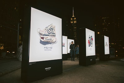 An image of Andy Warhol's Chuck Taylor All Star sneakers lit up the New York plaza as part of the 'In Their Chucks: 360°Experience.' The exhibit showcased how each wearer customized their pair, including lots of hand-drawn decorations.