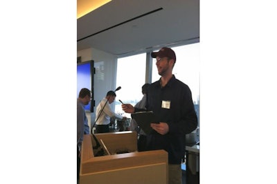 A Watson Adventures MC engages and eggs on teams between rounds and between questions during a Trivia Slam event, keeping the event fast-paced and laugh-filled.