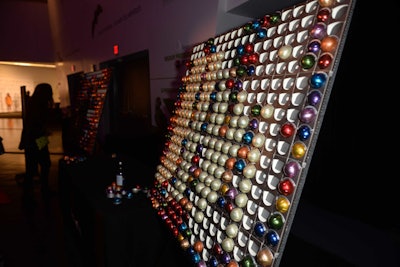 Sponsor Nespresso designed an interactive coffee-pod wall, arranged by color, where guests could pick and choose their caffeinated drink of choice. Guests could then bring the coffee pods over to a Nespresso machine to brew a hot drink.