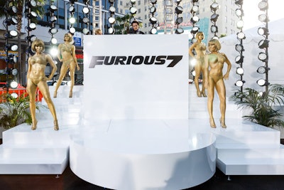 At the red-carpet entrance to the screening, dancers in gold body paint flanked a sleek white DJ booth. The dancers were inspired by a scene in the film in which characters attend a luxurious party in Abu Dhabi.