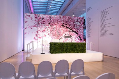 Printed graphics bloom on a stage backdrop for stunning ceremony decor at the Art Institute Chicago