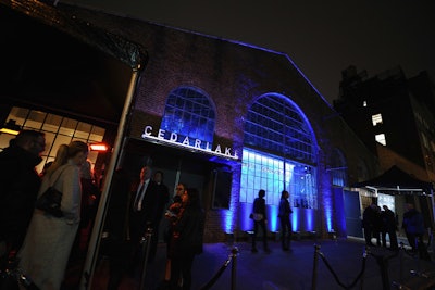 Organizers included pops of color, like the blue lighting that decorated the entrance at New York's Cedar Lake, in a nod to the phone screen's color quality.