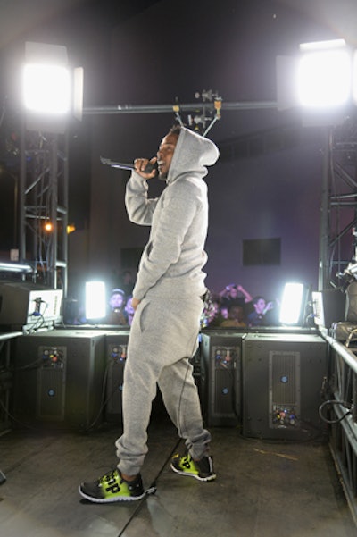 Clad in Reebok's ZPump shoes and the brand's clothing, Lamar entertained the crowd from a moving truck.