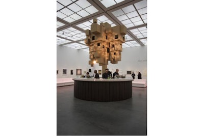 A black and white round bar beneath a custom cardboard focal for the MCA Art Auction gala