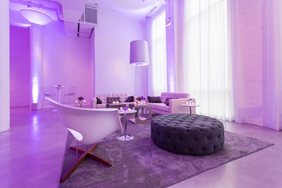 A contemporary lounge collection next to the 17' tall windows at Chez.