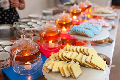 Occasions Caterers served hot tea with pink, yellow, green, and blue iced cookies for dessert at the Washingtonian's Alice in Wonderland-theme AT&T Best of Washington Party in July 2014, held at the National Building Museum.
