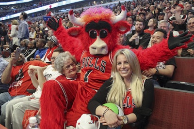 Some 7,000 people entered the Airbnb contest, and the winners were Virginia Labellarte (far left) and her granddaughter Danielle DiVito (right.) DiVito entered the contest for her grandmother, who has been listening to Bulls games on the radio or watching them on TV for decades.