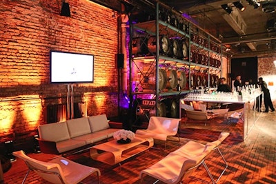 Mid-century modern furniture formed lounge areas for the Whitney Museum of American Art's Art Party at Highline Stages in May 2014. Designer Ron Wendt sourced the items from a collector, aspiring to match event sponsor Max Mara's aesthetic.