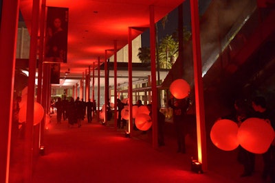 Following their energetic performance, the students lined the concourse with red lit spheres. As guests exited, they scooped up freshly made doughnuts and coffee.