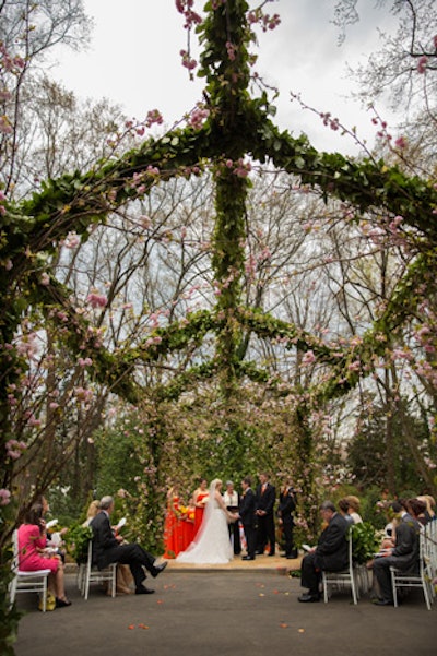 'Fresh greenery and 3,000 cherry blossoms adorned a handmade trellis at the Estate for a unique summer wedding.'