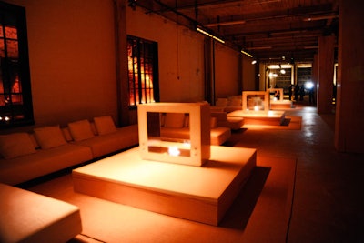 To cap off New York Fashion Week in 2010, Calvin Klein hosted a party with seating vignettes of minimalist, low-slung white sofas and ottomans around fireplaces.