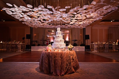 'Handmade paper flowers were suspended above the dance floor to striking effect.'