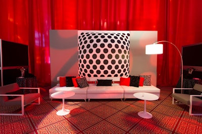 A white sofa and sleek tulip tables allowed the mesmerizing black-and-white backdrop, which was inspired by Roger Sterling's office on the show, to pop at the 2013 corporate party in Washington.