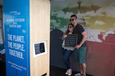 At a photo booth, guests could select one of five messages to hold in their photos. The messages detailed specific actions guests would take to make the world more sustainable.