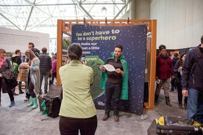 Livegreen, an eco-friendly home improvement company, offered a photo opportunity that let guests don green capes and pose in front of a backdrop that said: 'You don't have to be a superhero to make our planet a little greener.'