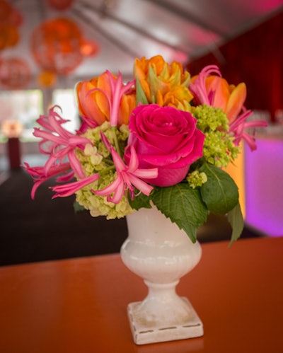 Erik Duran used pink, orange, and green for the flowers on the cocktail tables in the reception tent.