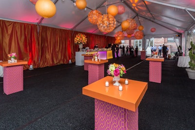 Design Foundry kept the reception tent to a color palette of orange and pink. The florals set the stage for the springtime colors used throughout the dinner tent.
