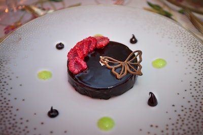 For dessert, Occassions Caterers served a chocolate and hazelnut dacquoise with gilded raspberries and a chocolate butterfly.