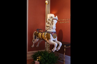 In the Graham Room, where dinner was held, thematic decor included carousel horses.