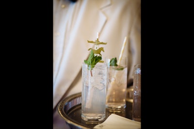 The passed specialty drink was called the 'Carousel Cocktail.' It contained ginger, lemonade, and vodka and was garnished with fresh mint and a striped paper straw embellished with a miniature carousel horse.