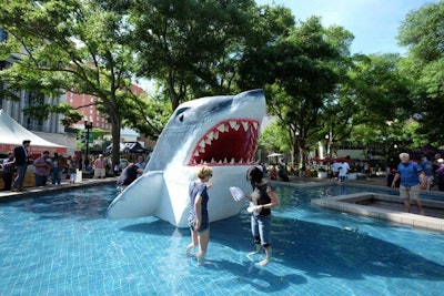 Sculpture students from the University of North Florida created a huge shark sculpture that appeared to rise out of a fountain in Hemming Park.