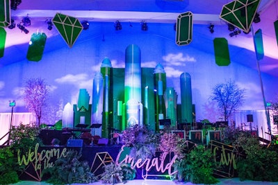 The Emerald City ball had an Oz theme, with decor pieces in the form of oversize green gems hanging overhead.