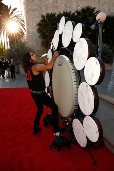 Drummers from Earth Harp Collective performed near Chris Burden's 'Urban Light' lamppost installation.