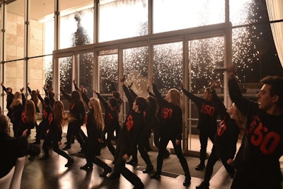 A 60-student performance group from John Burroughs’s High School Powerhouse Choir created and sang a birthday medley to Lacma, backed by a firework wall display.