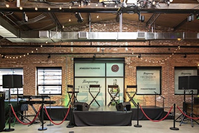 The informal panel setup included directors' chairs in front of a branded backdrop.