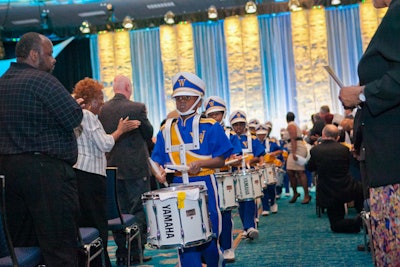 A marching band provides entertainment for guests at the Broward County Convention Center