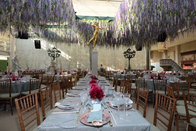 To create a feeling of intimacy in the expansive Engelhard Court, Avila and his team lowered the ceiling to 14 feet by hanging nearly 200,000 stems of wisteria overhead. Guests called to dinner via Chinese gongs found de Gournay hand-painted wallpaper created by traditional Chinese artists covering the Central Park-facing windows.