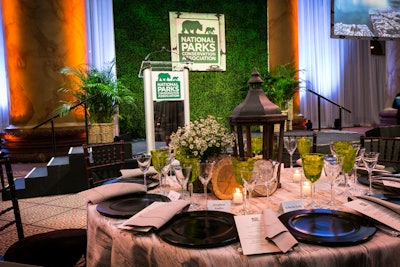 The Center Court of the National Building Museum was turned into a park-like setting with unique floral and tabletop decor.