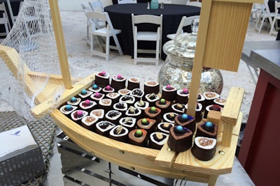 At the Ritz-Carlton South Beach in Florida, the catering team surprises guests at social functions with a “sushi cupcake” setup. The station presents the whimsical cakes on a boat-like stand.